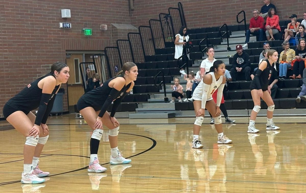 The Cashmere Bulldogs volleyball team locks in defensively during a home match, showcasing the focus and intensity that have propelled them to a 2-0 start. The squad now sets its sights on top-tier competition at the SunDome Volleyball Festival in Yakima.
