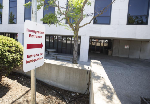 An "Immigration sign" posted in the U.S. Department of Homeland Security office located beneath the Wenatchee City Hall.