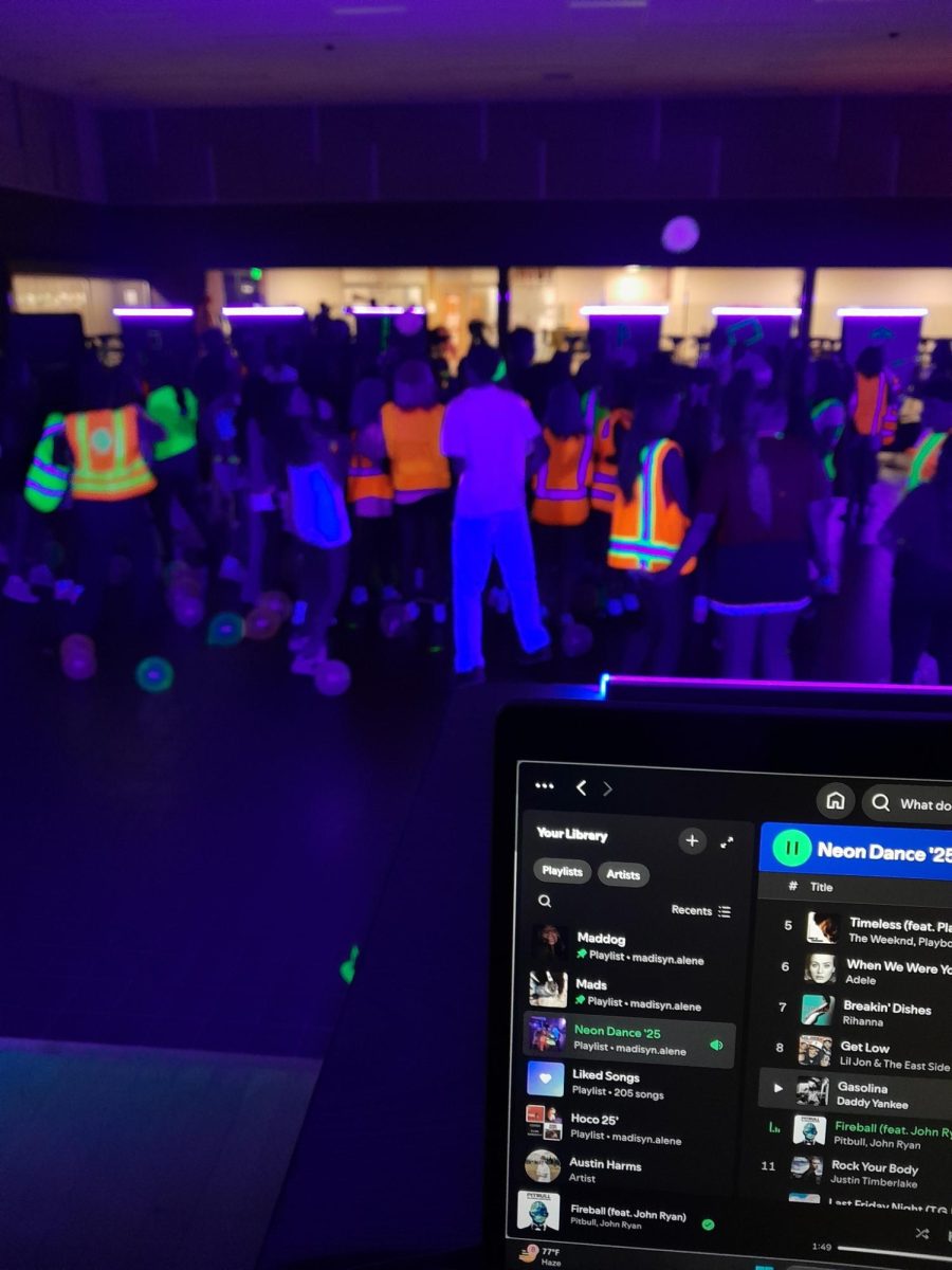 Students at Cashmere High School jump to the song “Fireball” in their neon colors after the football game was cancelled on September 5th.