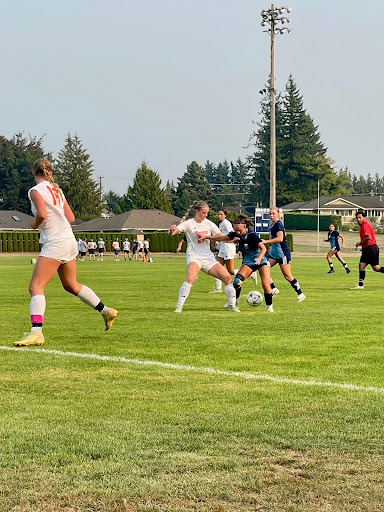 Addison Talley fighting to win the ball back to get a chance on goal.