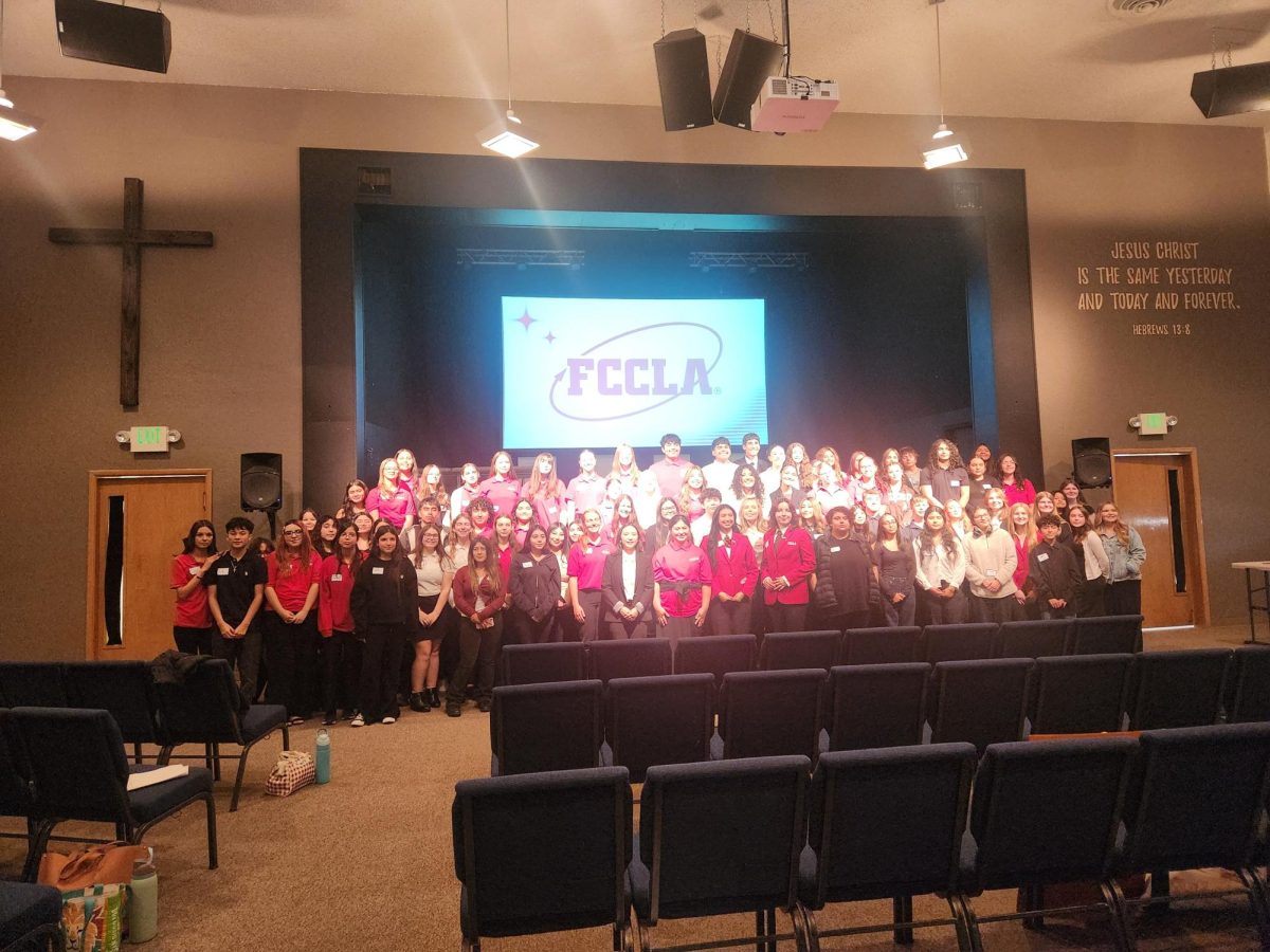 Cashmere FCCLA poses standing on the stage after the FCCLA Conference.