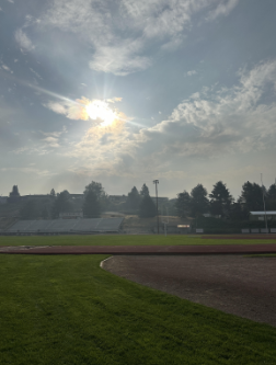 The sun glows from lingering smoke over CHS.