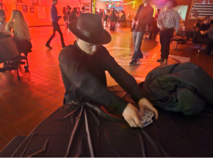 CHS senior teaches dance attendees how to gamble.