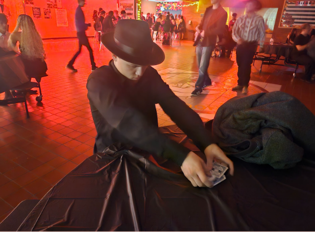 CHS senior teaches dance attendees how to gamble.