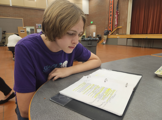 Micah Meloy reviews his script for A Midsummer Night’s Dream.