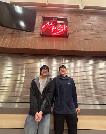 Tran and Ceja pose in front of the school store where, a month earlier, they stood holding signs that protested injustice.