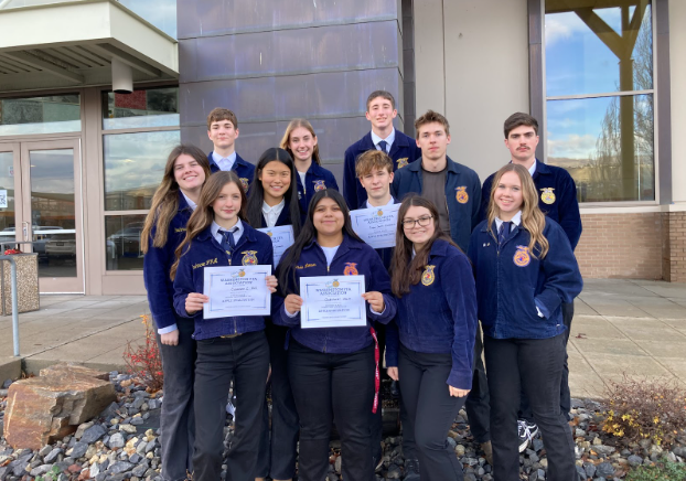 Cashmere’s FFA apple judging team stands proudly displaying their achievements outside of the Wenatchee Performing Arts Center.