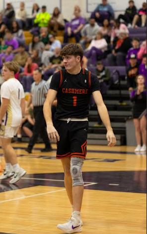 Senior captain Tobie Larson walks down the court as he leads the Bulldogs into their home opener.