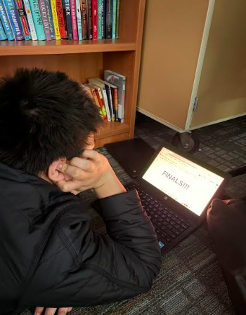 Alvaro Ferrer-Sierra poses in a well-recognized pose by many students: overwhelmed, tired, and stuck.