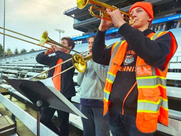 Brass and Volume: Oliver Chalmers, Angel Moreno, and Quentin Christensen blasting their horns into Husky Stadium. 

It was a sublime experience for the band when they walked out into Husky Stadium, the largest live venue in the state. The mass of Cashmere fans, almost all in orange and black, cheering on the team, warming up on the field, set an incredible tone, especially considering that this was the end of the line for the Bulldogs. When all was said and done, the band was locked and loaded to provide sonic glory to the team and their fans.

