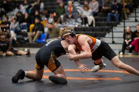 Junior State Champion Jance Novak dominates his opponent as he leads the Bulldogs to championship run.