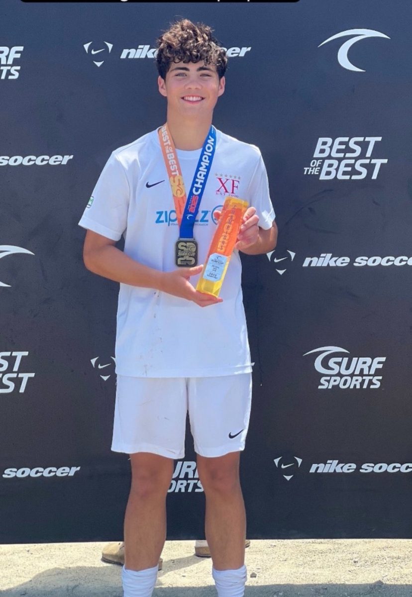 Tommy Bataniou posing for a picture after winning Surf Cup in San Diego.