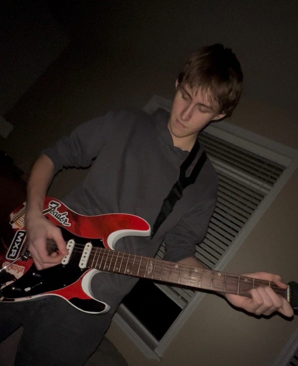 Kamren Meloy Practices Guitar at Home